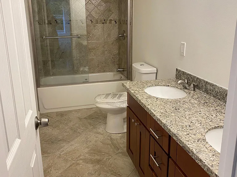 Shared bathroom on main floor. Mirrors will be installed prior to move-in date.