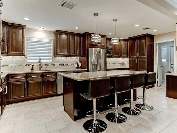 The kitchen is amazing with many pull outs and REAL WOOD cabinets galore Be sure to check them out.