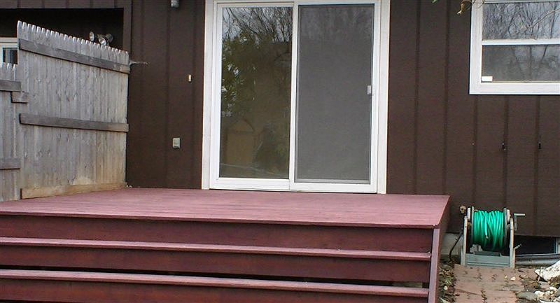 Walkout deck to fenced in back yard