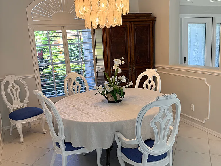 Dining room table and storage armoire.