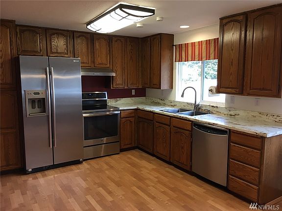 Spacious Kitchen features brand new countertops and has plenty of room for a mobile island.