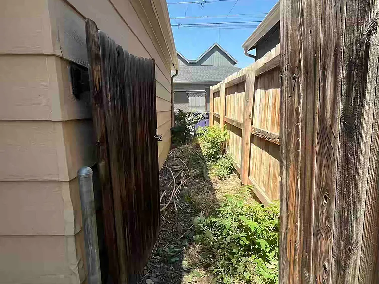 Gated alley access off backyard/garage side