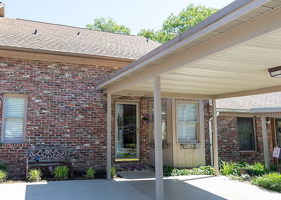 Wood crafted one car carport