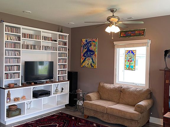 Entertainment center with excellent stereo speakers for your listening pleasure. Eclectic CD collection is optional or can be removed at your request. Same goes for the paintings and art.