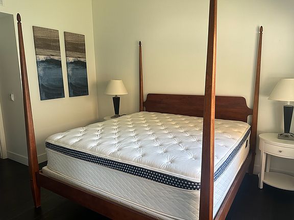 This is the King Size bed in the primary en suite included in rental. Linens are provided, but not shown here. Mattress is new WinkBed Plus.