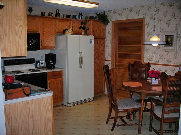 Eat-In kitchen with access to laundry/mechanical room and garage.