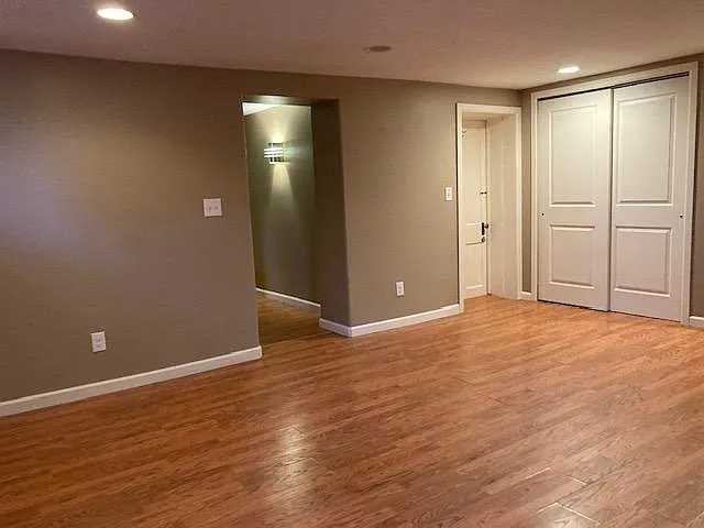 LR - SE. Door on Rt leads to additional storage and Laundry