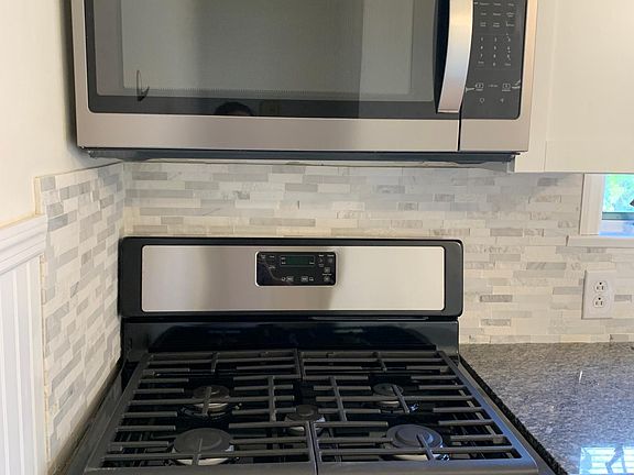Brand new whirlpool gas range and built in microwave