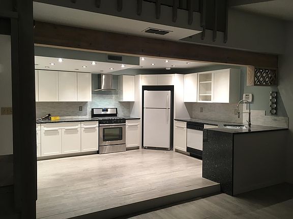 View of kitchen from fire place.