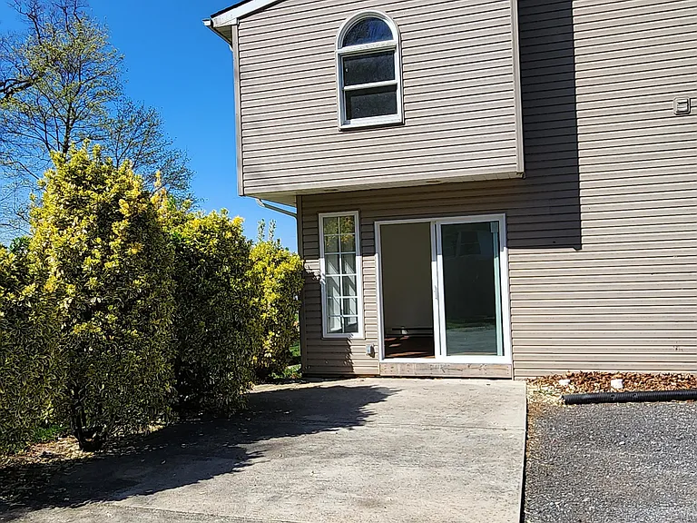 Back Patio and Gravel Parking Area