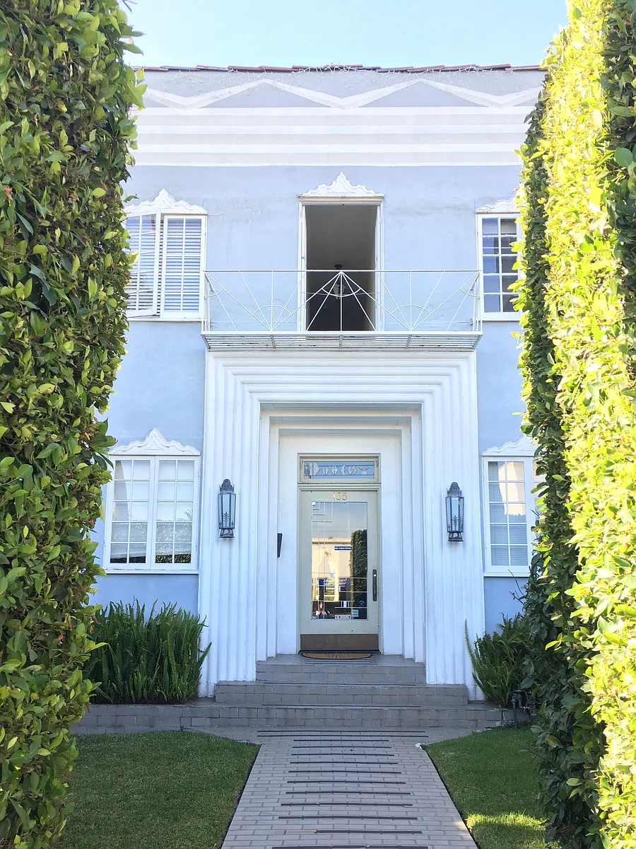Exterior with hedges - 455 N Doheny Dr #209