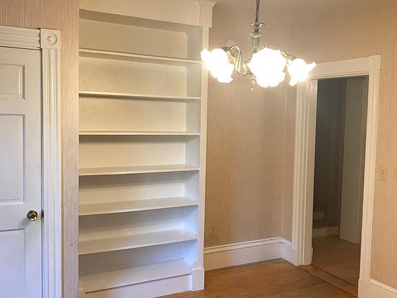 Dining Room with built-in bookcase and closet