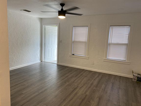 Large living room with remote controlled fan and dimming recessed lights