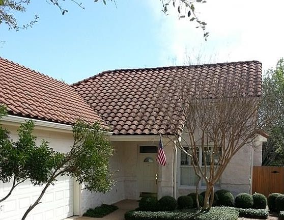 Concrete tile roof, slurry stucco, side entry spacious 2 1/2 car garage.