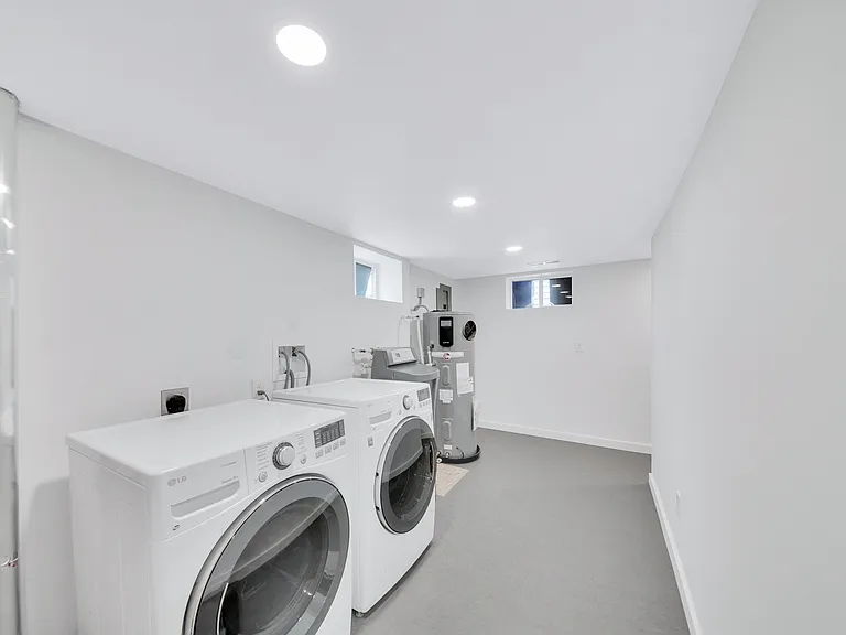 Laundry area in lower level of home