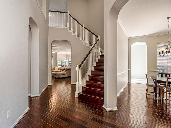 Wow!! What a stunning entry with soaring ceiling, hardwood floors and fresh paint.