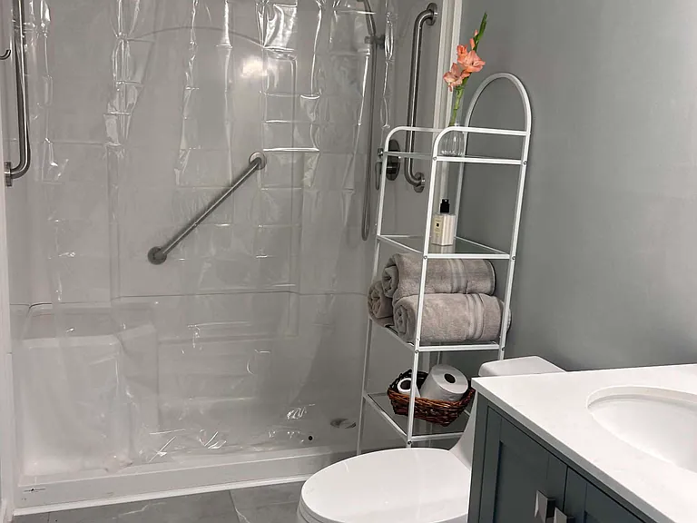 Bathroom #1- main floor

walk in shower, new everything!

opens to primary bedroom and hallway