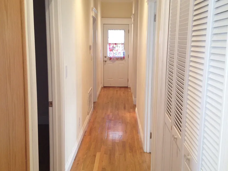 Well-lit hallway with hardwood floors in USC graduate housing - modern updates near campus