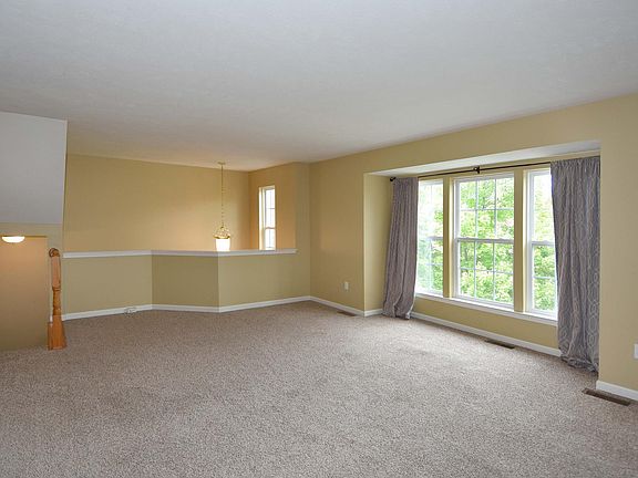 The main living room or great room is spacious and has huge windows