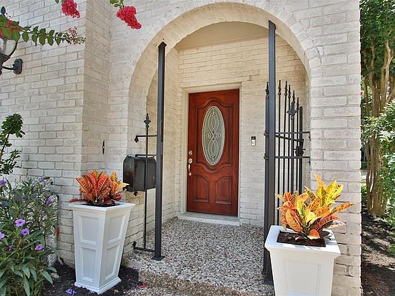 You will be proud to greet your guests at the covered front porch as you open the solid wood door with a classic glass inset.