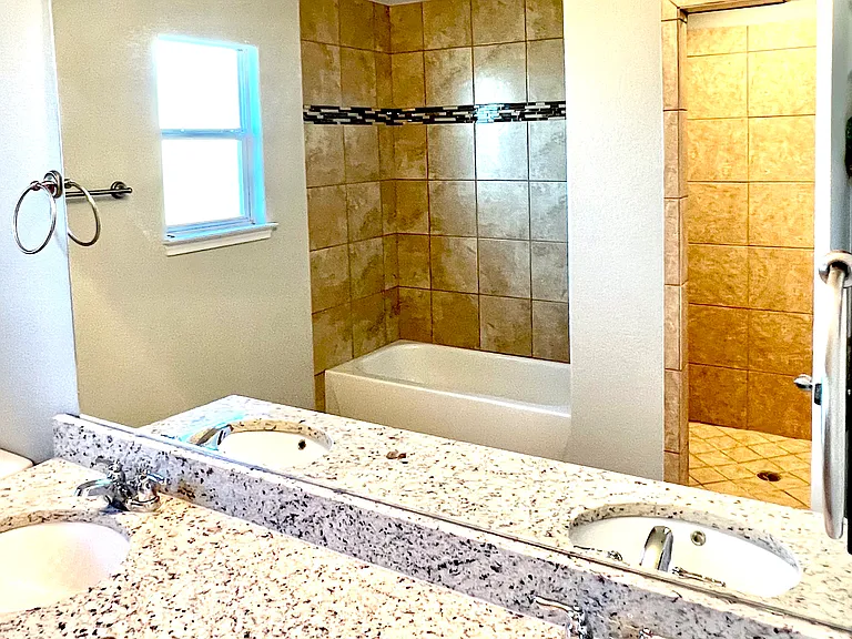 Main Restroom, 2 Sinks, 1 Standard Tub, 1 Stand up Shower