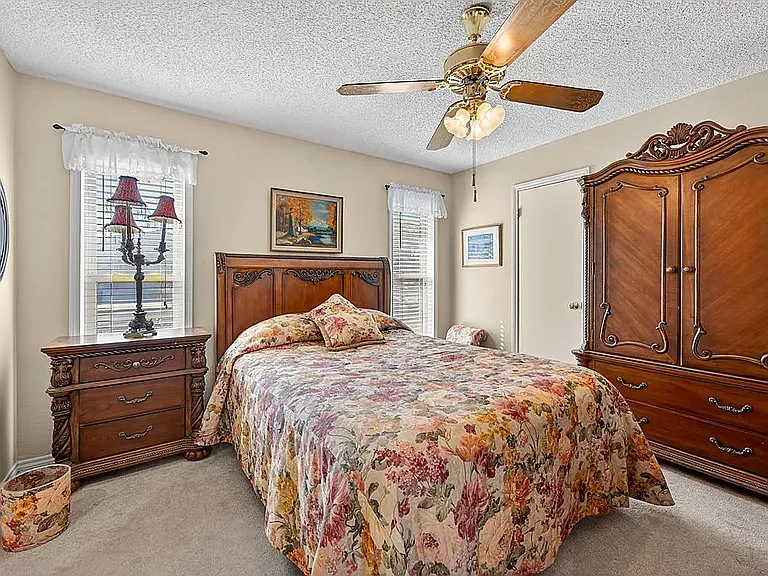 2nd bedroom. Picture shows a queen bed, armoire, nightstand & there is a separate dresser (not included - but showing large room & space available)