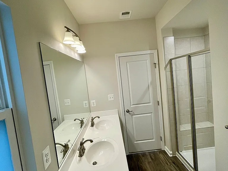 Large walk-in shower with built-in seated bench