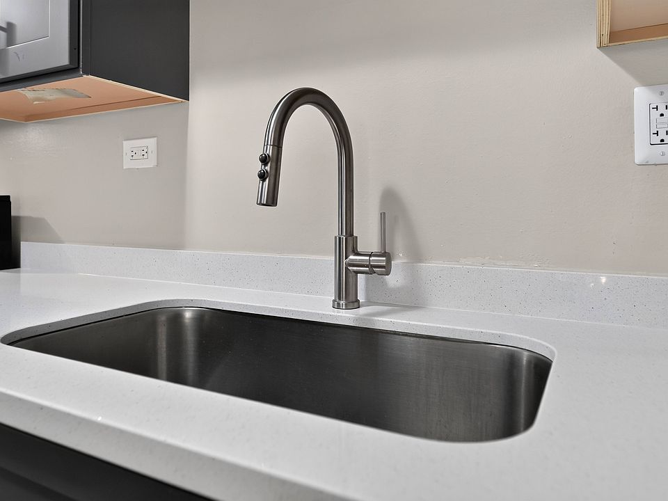 Enjoy modern finishes like this sleek chrome faucet and sink at Renaissance at Carol Stream in Carol Stream, IL.
