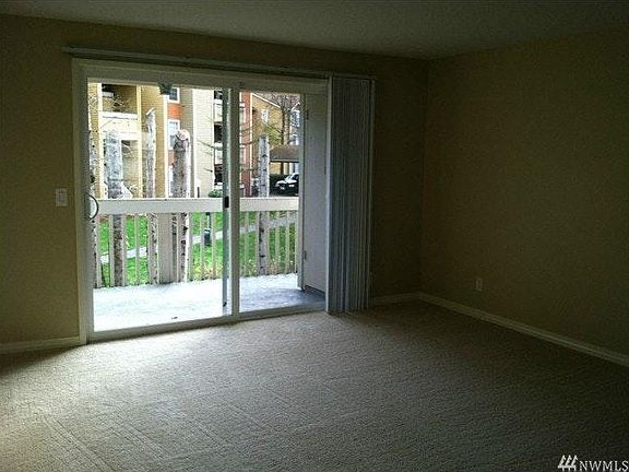 Living room with sliding glass door to balcony