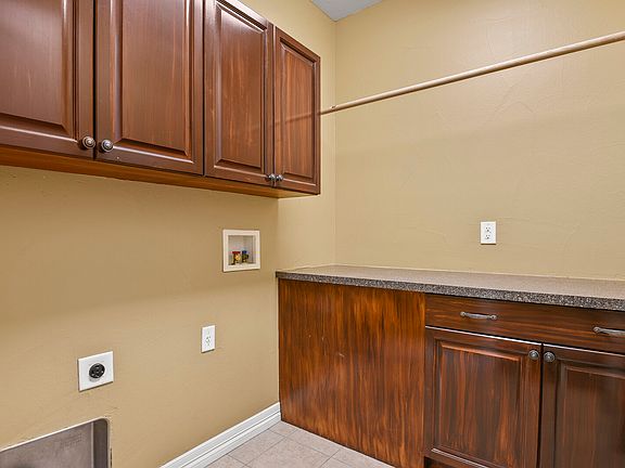 Laundry room with cabinets