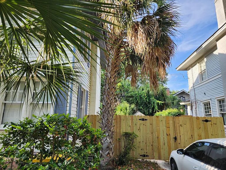 Fencing into back yard/driveway