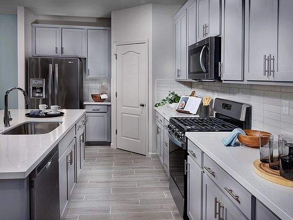 Residence 2 kitchen modeled at a nearby Meritage community.