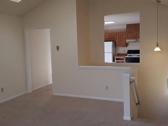 view over stairs living room to kitchen