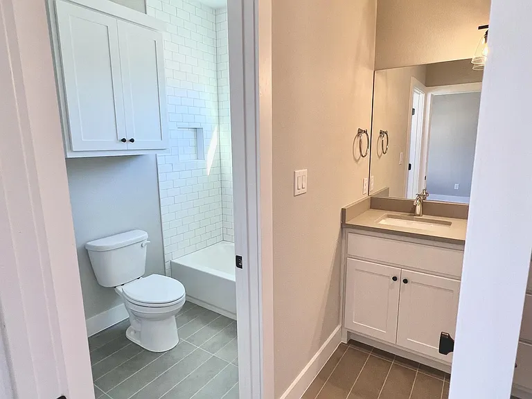Private bath in the jack and jill bathroom for bedrooms 2 & 3 on the second floor.