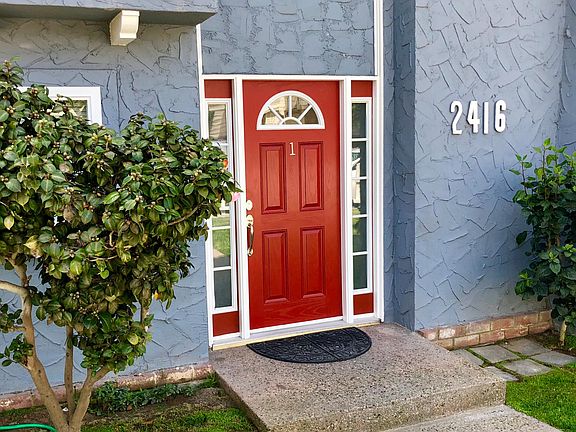 Welcome home! Enter through the fenced yard and the vibrant 