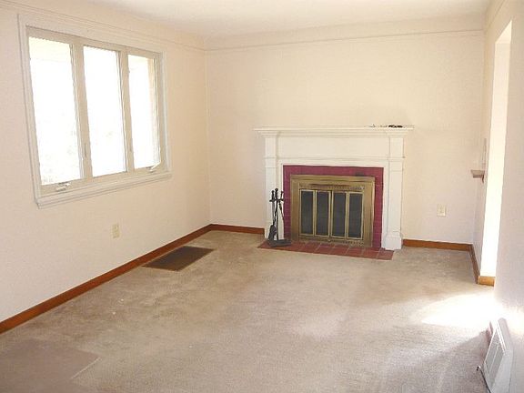 Living Room with Log Burning Fireplace