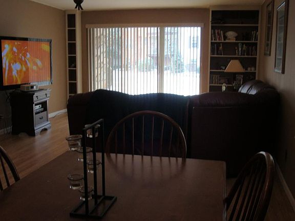 living room looking from back wall out to sliding glass door