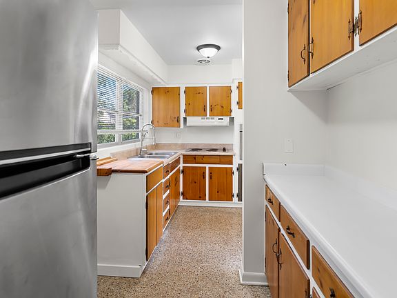 Kitchen w extra counter space for coffee station and microwave