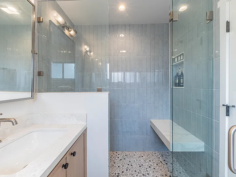 Primary Bathroom with 2 sinks, towel heater and shower