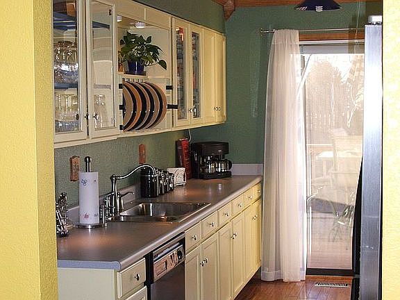 Contemporary Galley Kitchen with Custom Cabinets and Wood Floors