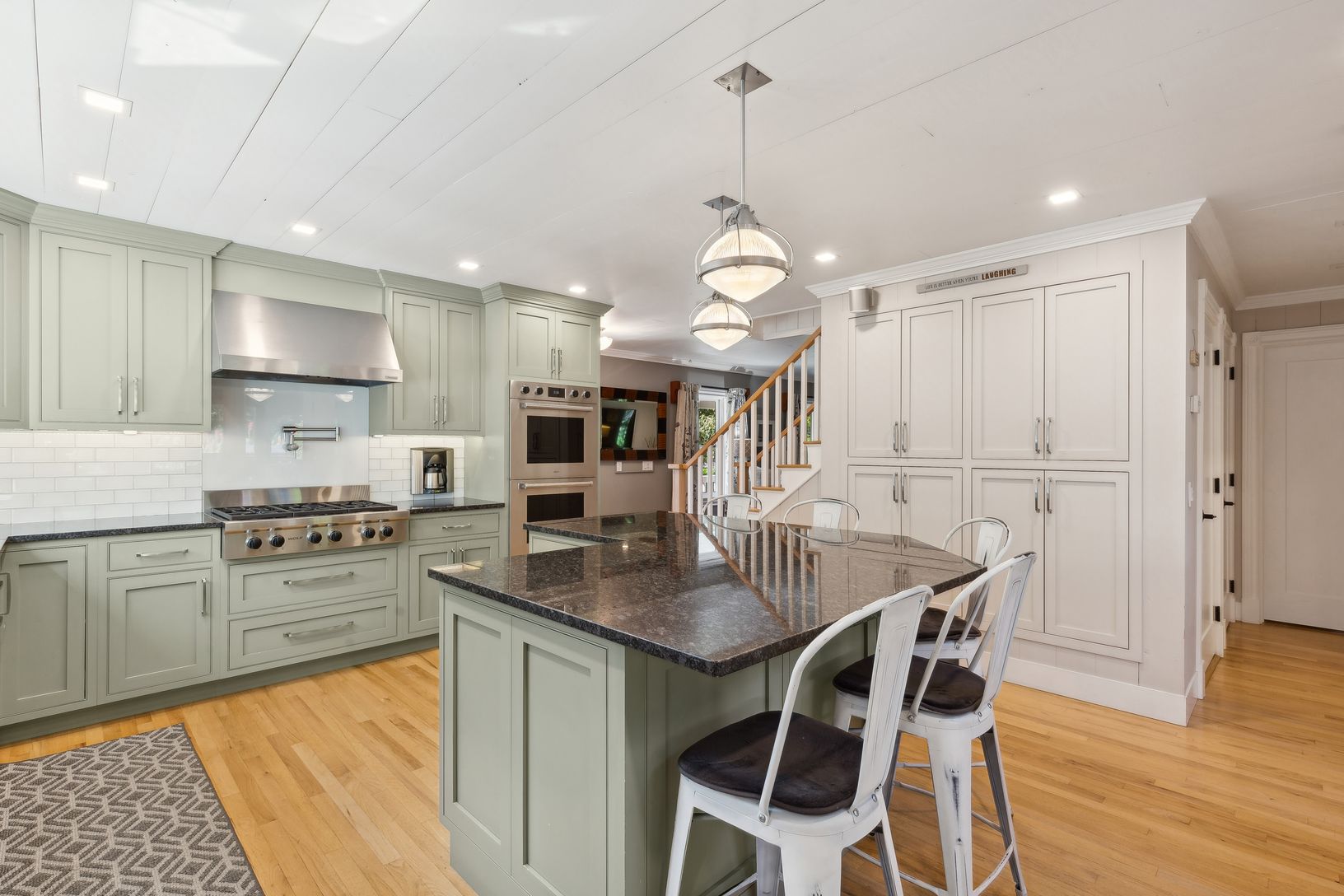  Kitchen Featuring Stainless Steel Appliances, Black Granite Countertops, Wolf 6 Burner Gas Cooktop