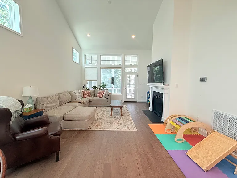 Living room w/ recessed lighting. Look at those ceilings!
