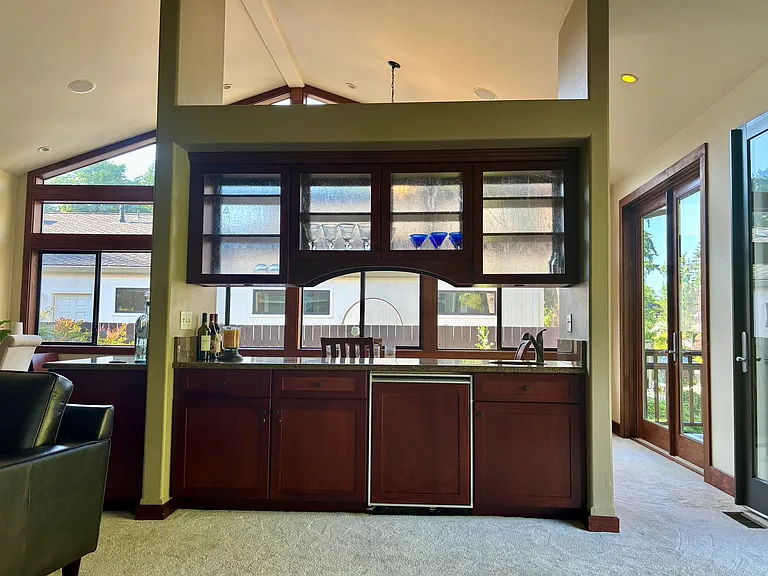 Bar/buffet separating living from dining room.
