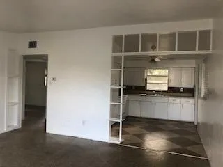 living / kitchen - laundry room off kitchen on back right (not pictured) w washer /dryer and storage area /carport access. - 1338 Alaska Ave