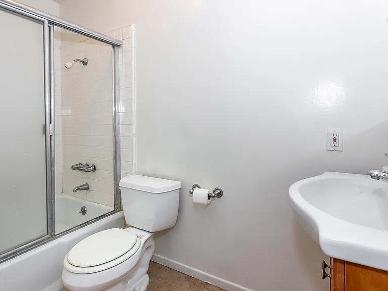 Off the hall, is a generous sized full bathroom with tub and shower. Another bathroom is off the primary bedroom.