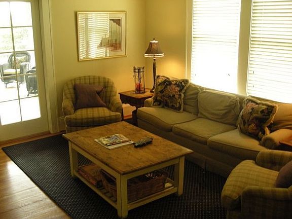 Informal Den Opens to Screened Porch