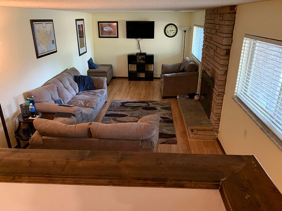Downstairs den with wood burning fireplace