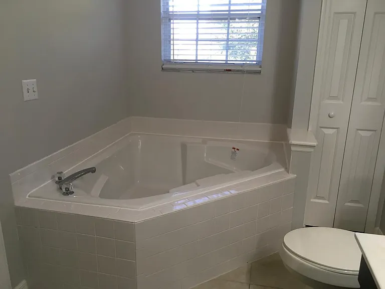 Master Bathroom tub with Roman tub.