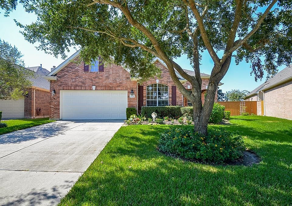 This handsome 1.5 story, single family brick beauty is located at Almond Orchard Lane, Katy, TX, in the Cinco Ranch West/Heritage Grand 55+ community. Excellently maintained inside and out, the home shows proud ownership and impressive curb appeal.