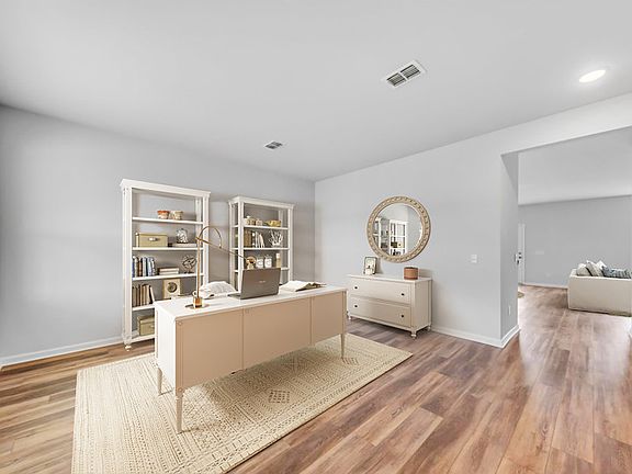 Utilize this bright and welcoming flex room as a peaceful study space.